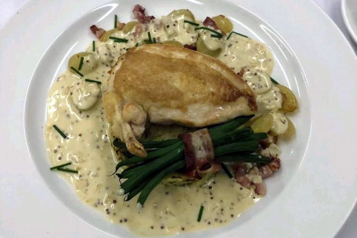 Chicken dish with smoked bacon, grapes, green beans and wholegrain mustard sauce.